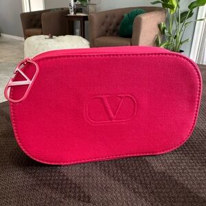 Valentino large make up pouch zippered with charm
NWT
